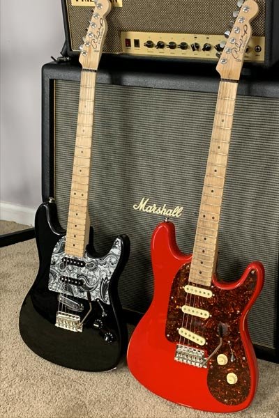 Pictured: A pair of Classic-S guitars.  The guitar on the left is rear routed for electronics, while the  one on the right is front  routed.